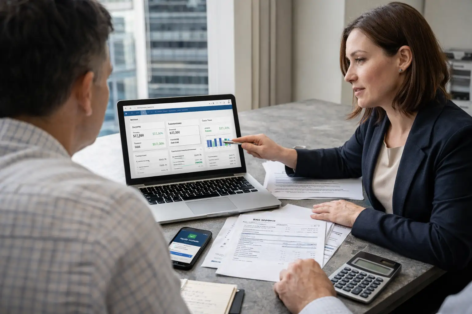 Accountants in Melbourne advising a local business owner on tax, payroll, and cash flow management in 2026